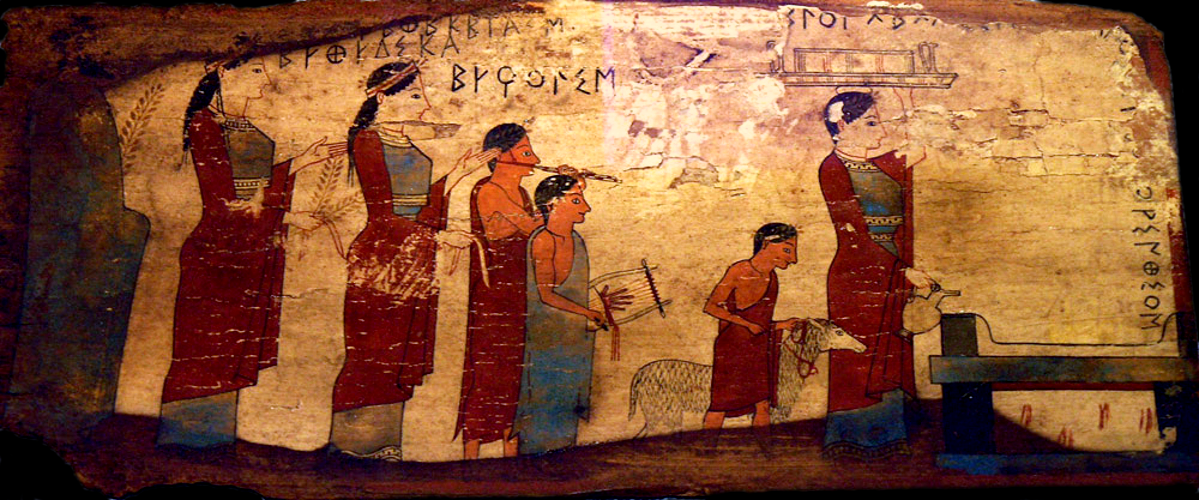 Corinthian Painted Wooden Plate, ca. 540-530 BCE depicting a procession to an altar to sacrifice a lamb, accompanied by flute and lyre. The names of the Three Graces are inscribed on the placque. Source: Wikimedia Commons