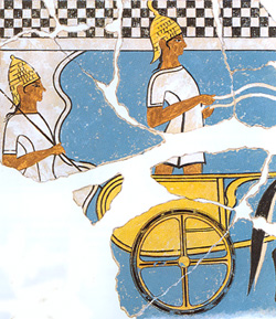 Two helmeted warriors and chariot on a Mycenaean fresco from Pylos, ca. 1350 BCE. Source: Wikimedia Commons