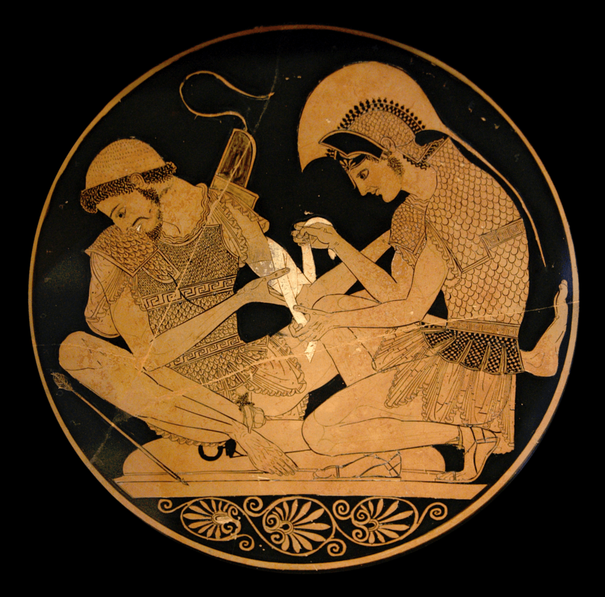 Tondo of an Attic Red-Figure Kylix, ca. 500 BCE, depicting Achilles tending Patroklos’ arm, wounded by an arrow. Source: Wikimedia Commons